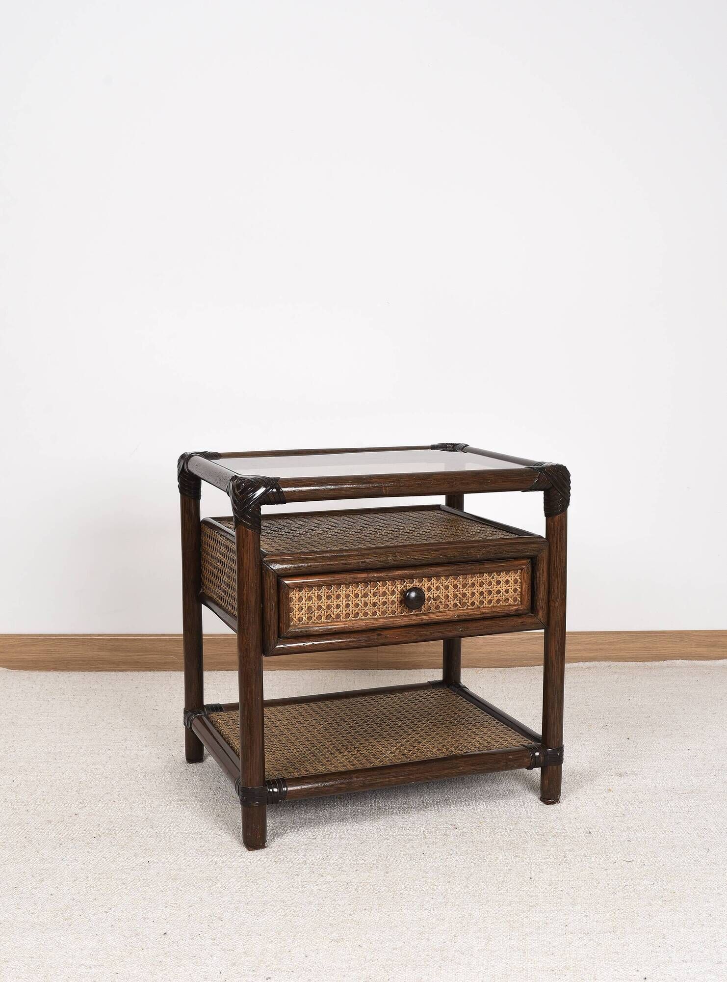 Rattan and cane bedside table, smoked glass top