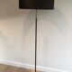 Floor lamp in black lacquered metal and brass