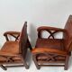 Paire de fauteuils style colonial en tech et cuir vintage