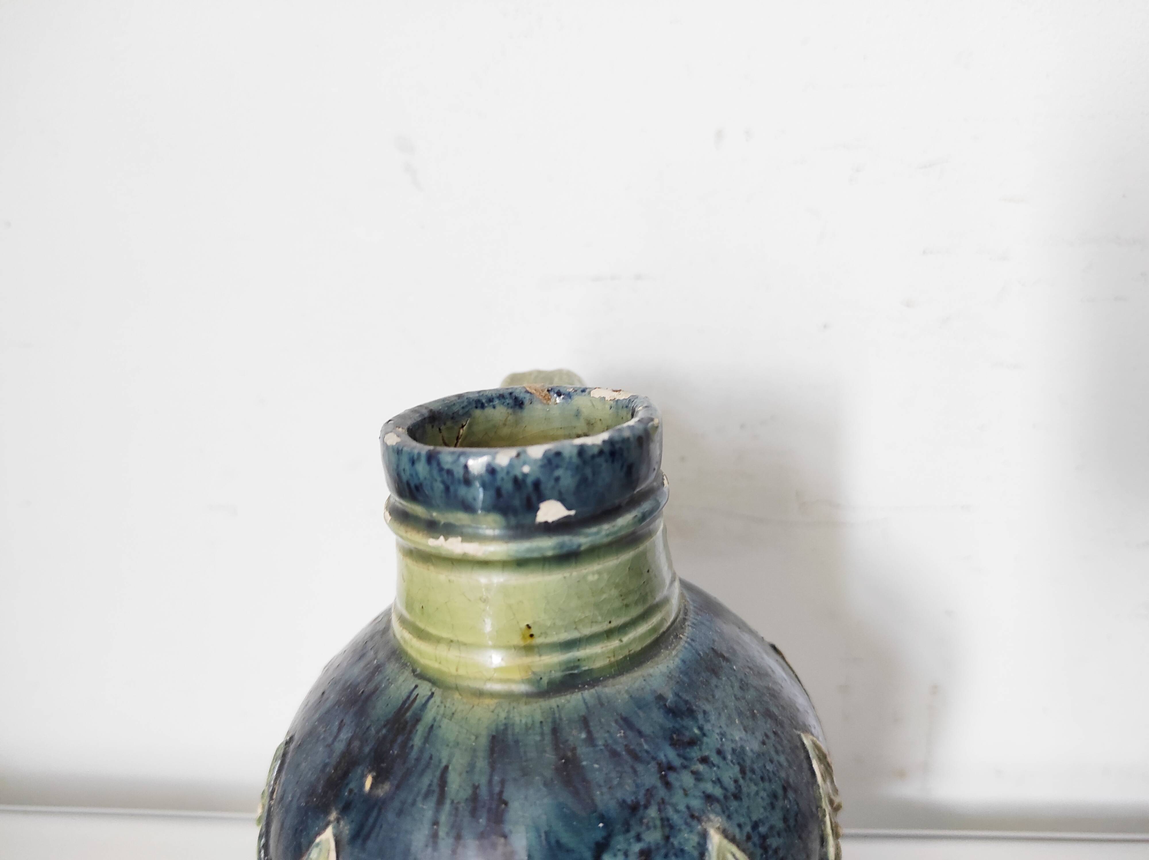 Two small blue ceramic vases