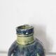 Two small blue ceramic vases