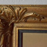 Old large wall frame in gilded carved wood
