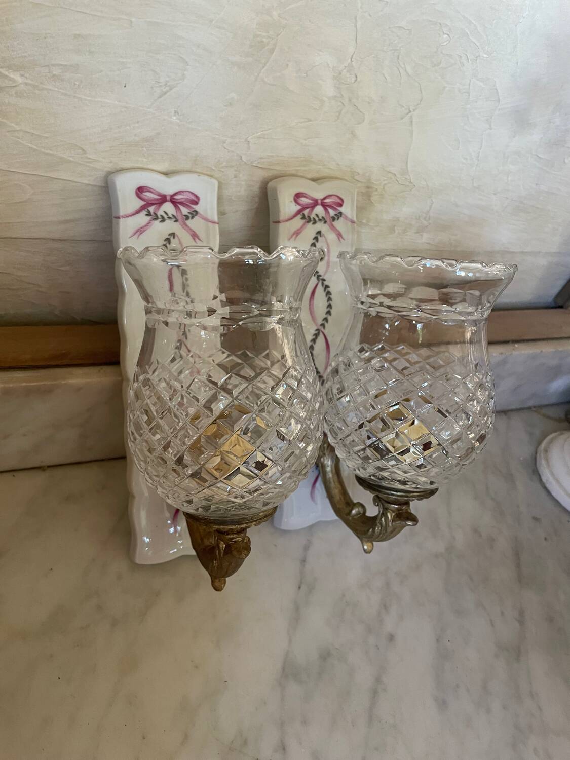 Pair of cut glass and Limoges porcelain wall sconces