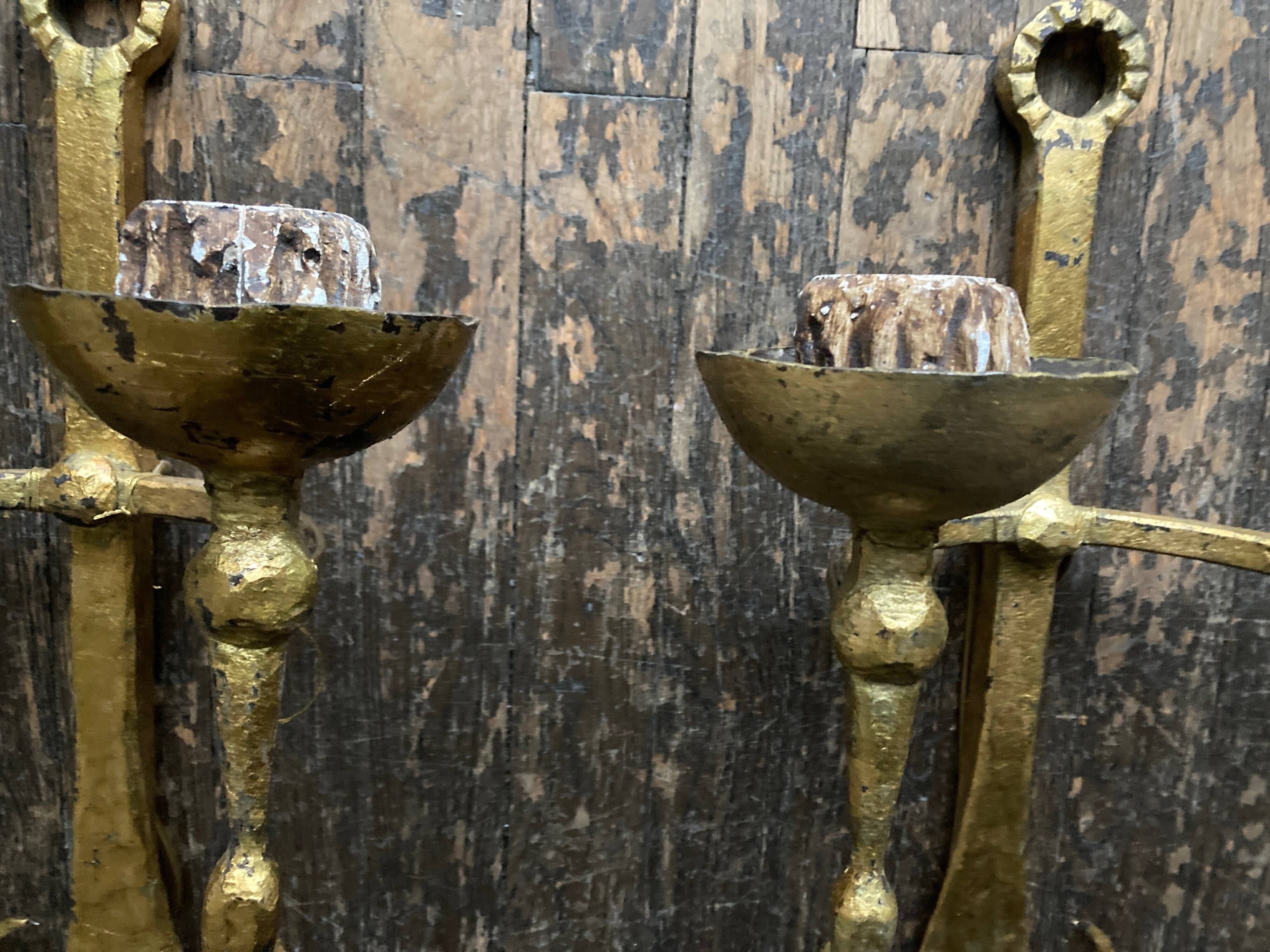 Pair of XXL torchlight sconces in golden beaten iron Italian work 1960