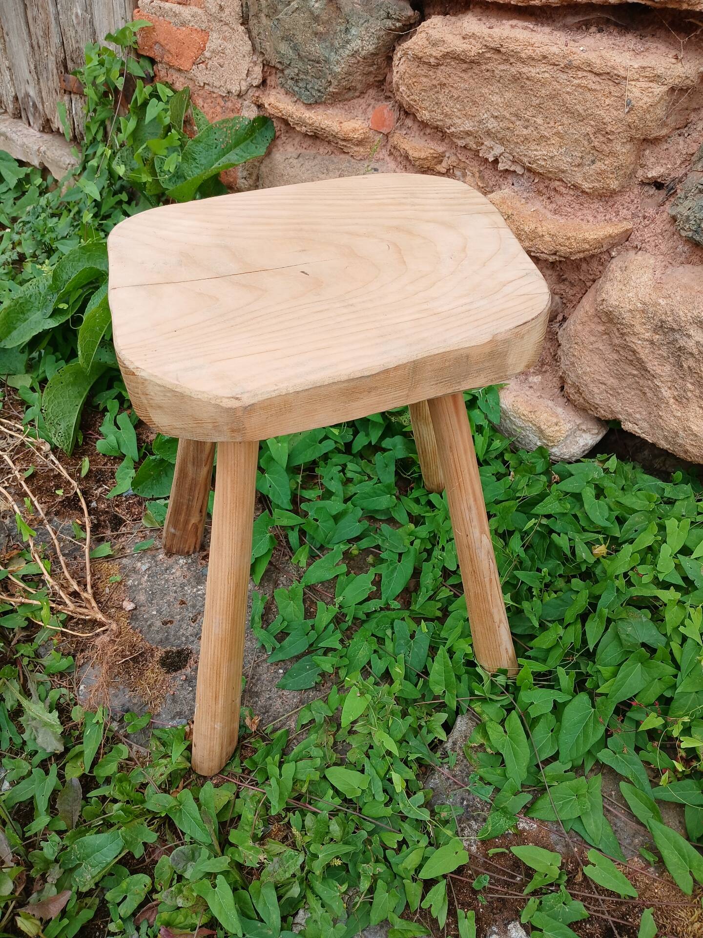 Antique stool in raw wood