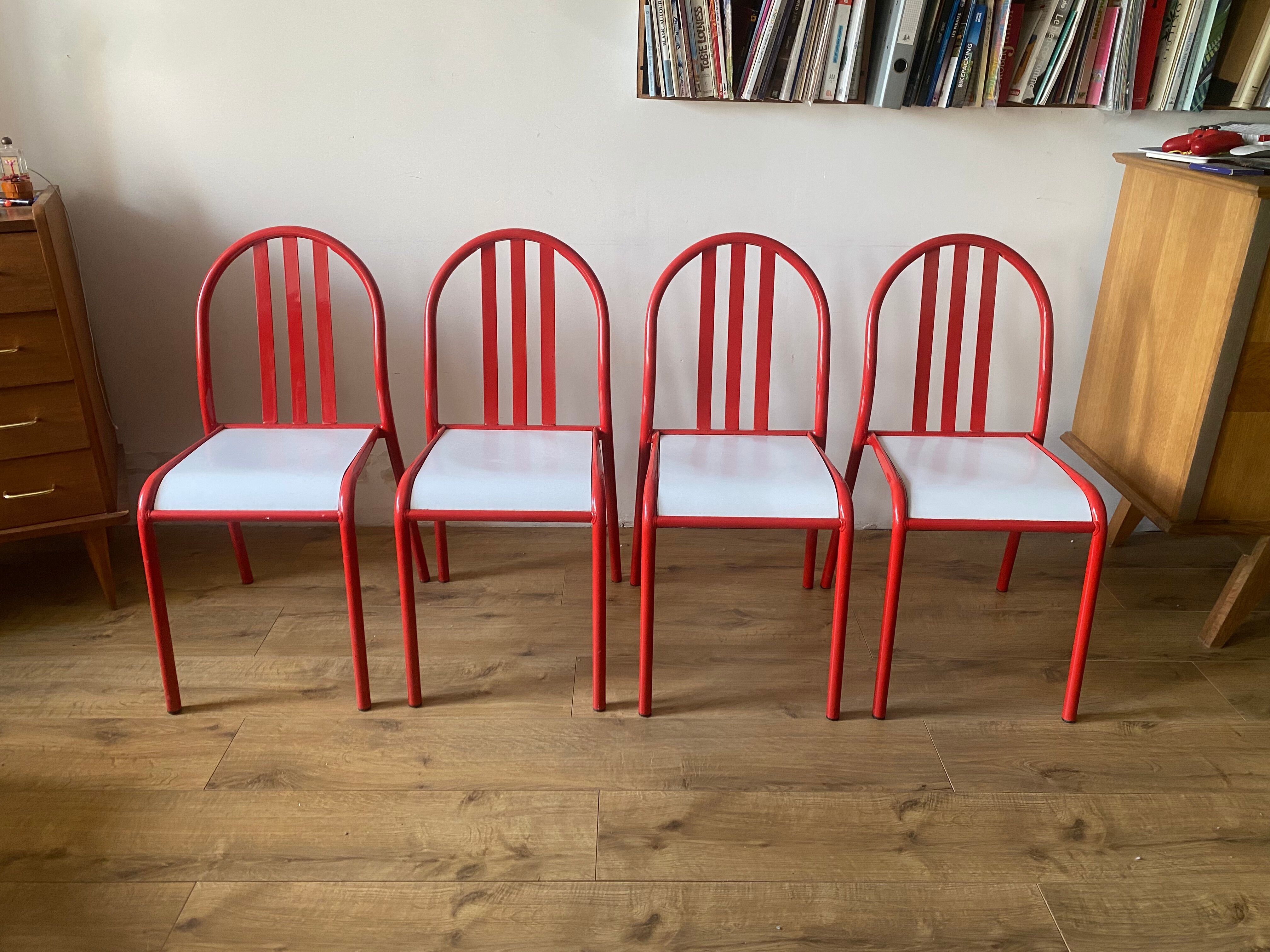 4 red metal chairs by Mallet-Stevens
