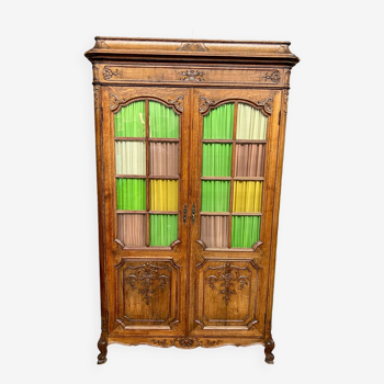 Liège bookcase in carved oak Regency style