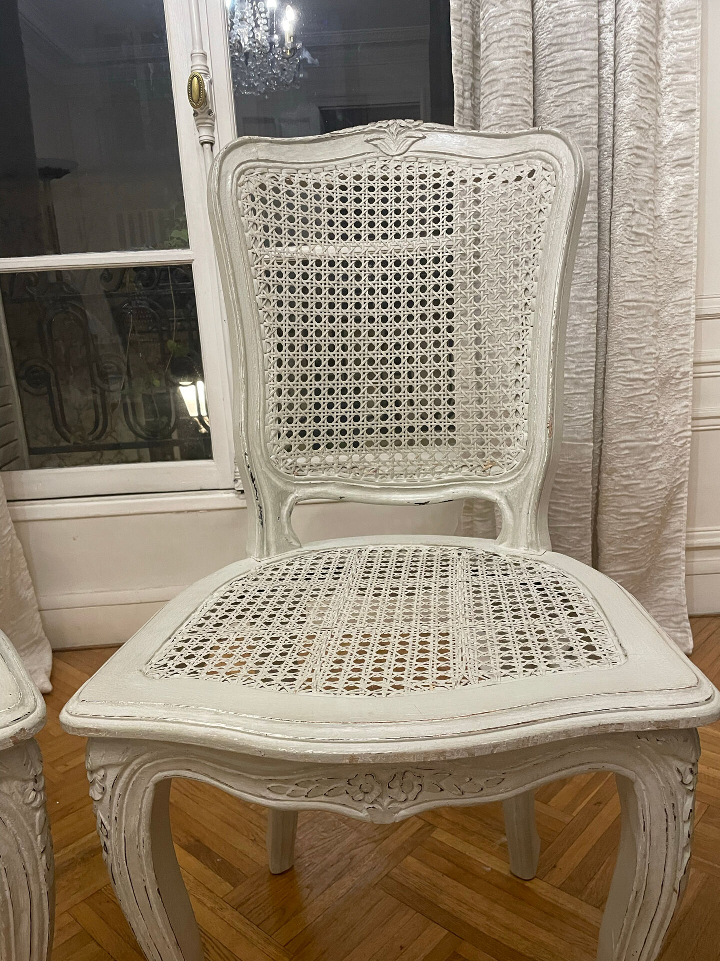 Set of 4 white caned chairs in Louis XV style.