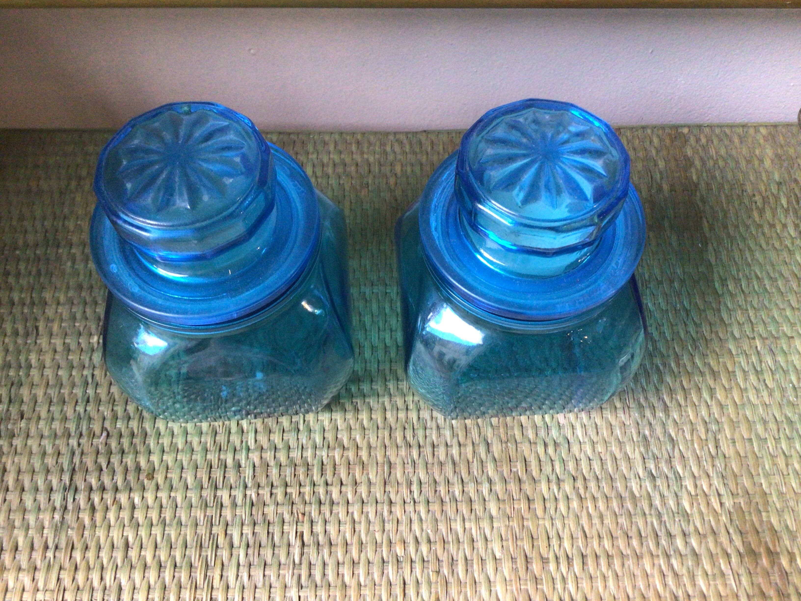 2 blue glass jars