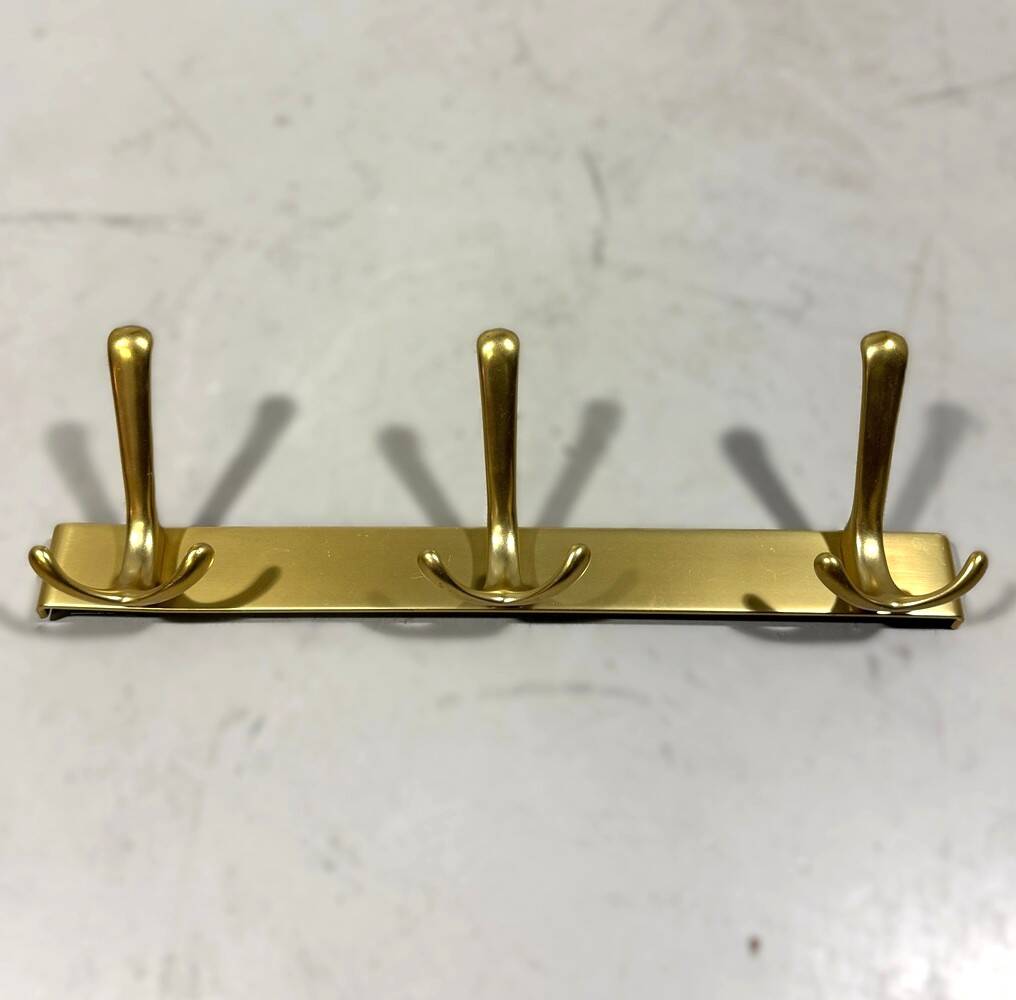 Gold coloured aluminium wall coat racks 1960’s