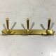 Gold coloured aluminium wall coat racks 1960’s