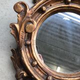 Miroir en bois doré Empire à décor d’aigle 40x97cm