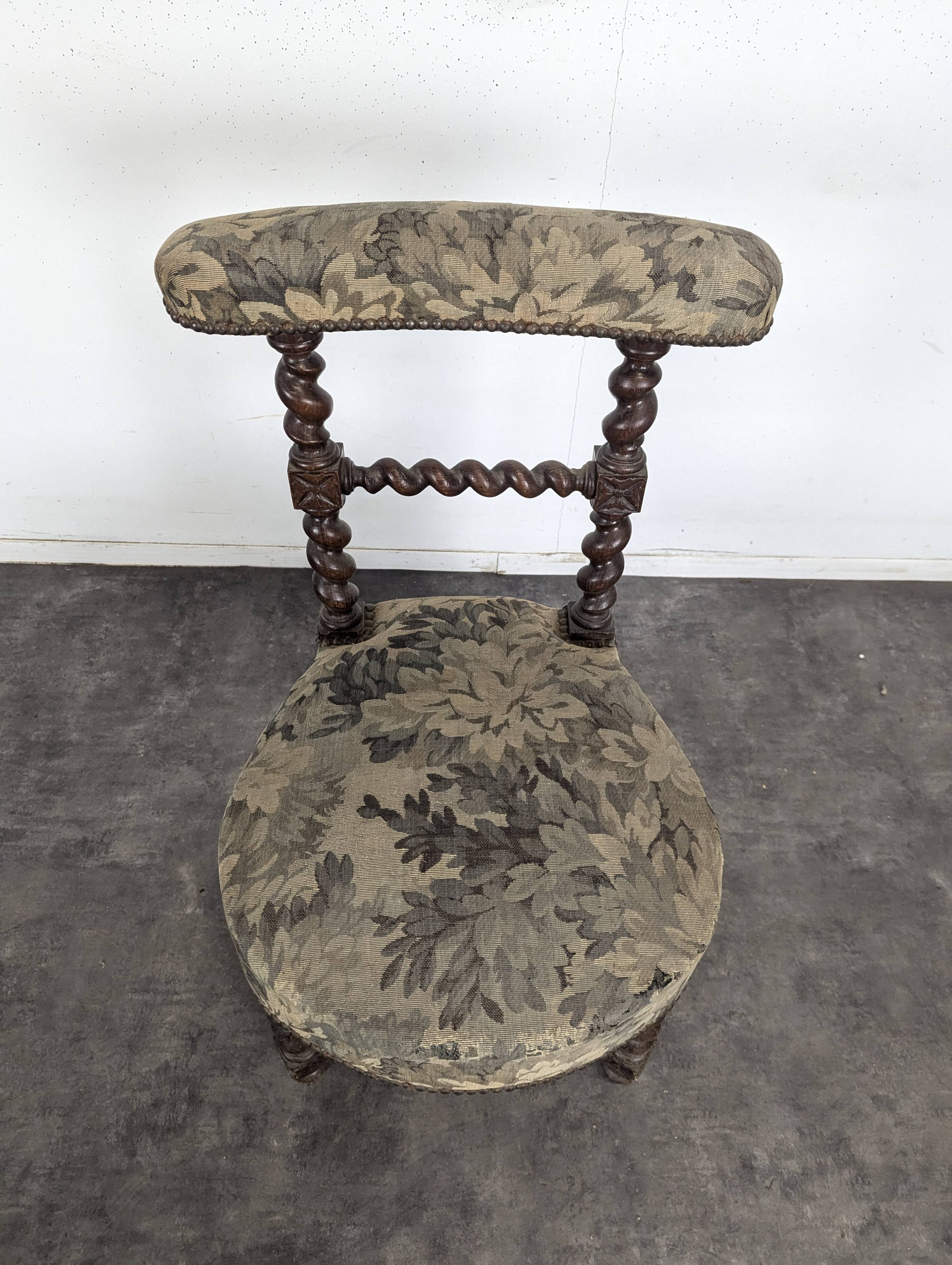 Napoleon III smoking chair in twisted blackened wood with foliage upholstery.
