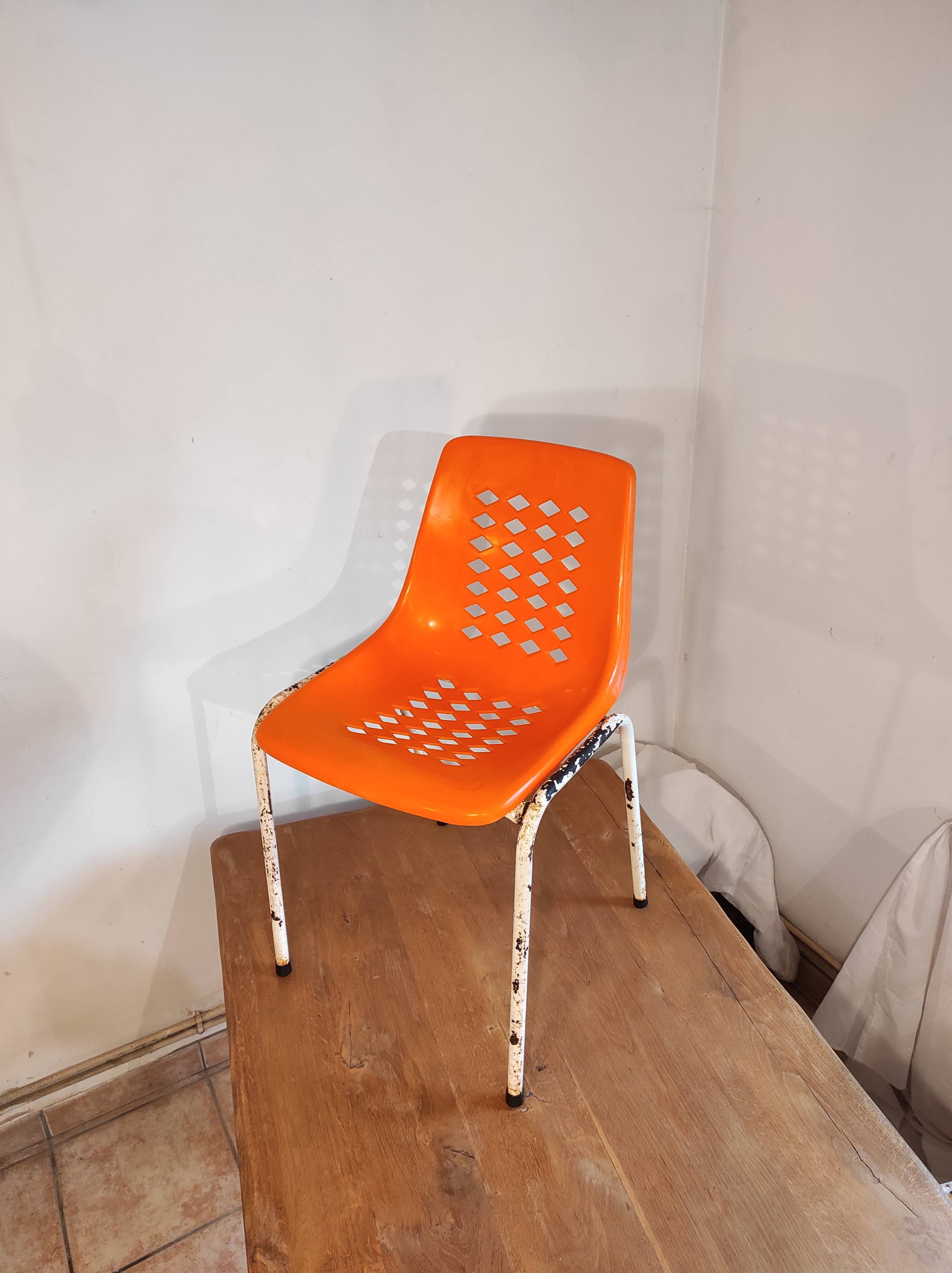 Chair with openwork plastic shell 1970