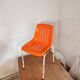 Chair with openwork plastic shell 1970