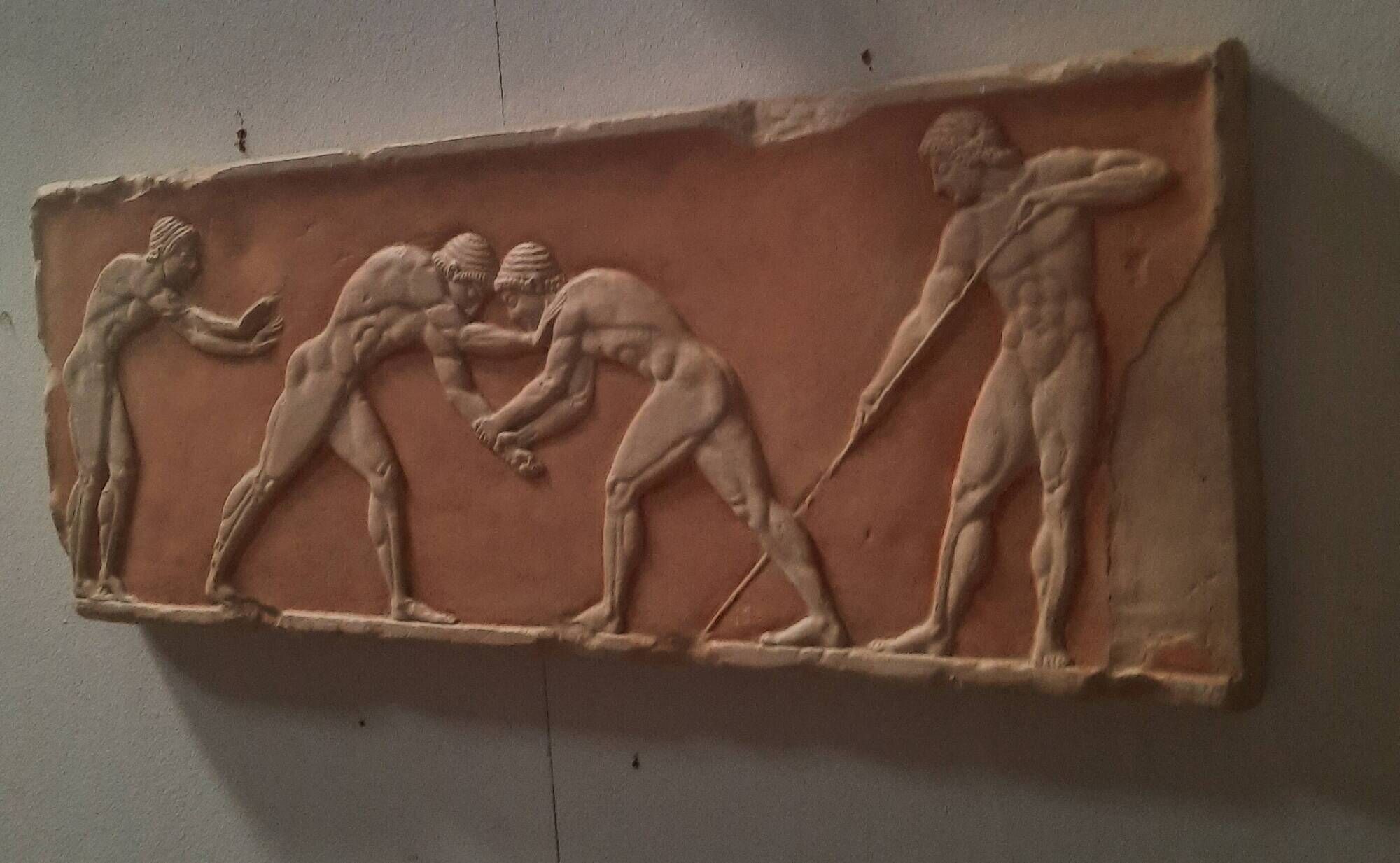Bas-relief in the antique style featuring athletes.