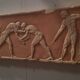 Bas-relief in the antique style featuring athletes.
