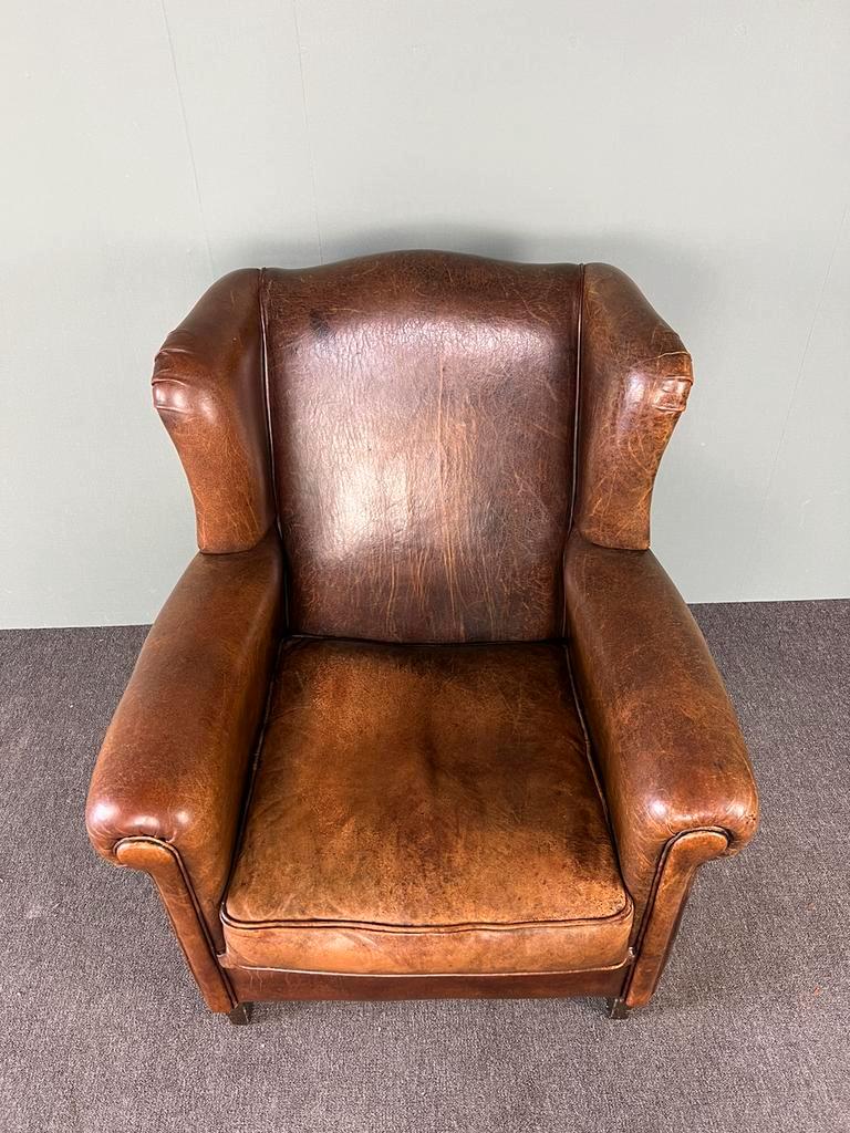 Vintage armchair in patinated sheep leather
