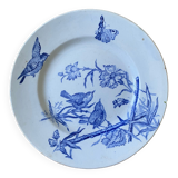 Plate decorated with blue birds and butterflies