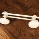 Vintage white metal coat rack with 2 hooks