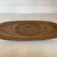 Carved wooden platter in Black Forest style.