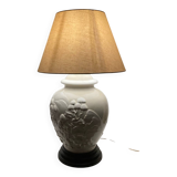 1980s ceramic table lamp with a wooden base and adjustable shade.