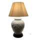 1980s ceramic table lamp with a wooden base and adjustable shade.