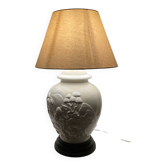 1980s ceramic table lamp with a wooden base and adjustable shade.
