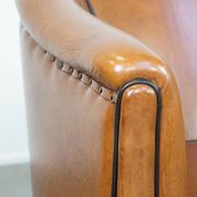 Set of 2 sheep leather club chairs finished with black piping
