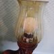 Suspension with three lights, turned varnished wood, amber tulip shade, 1970s.