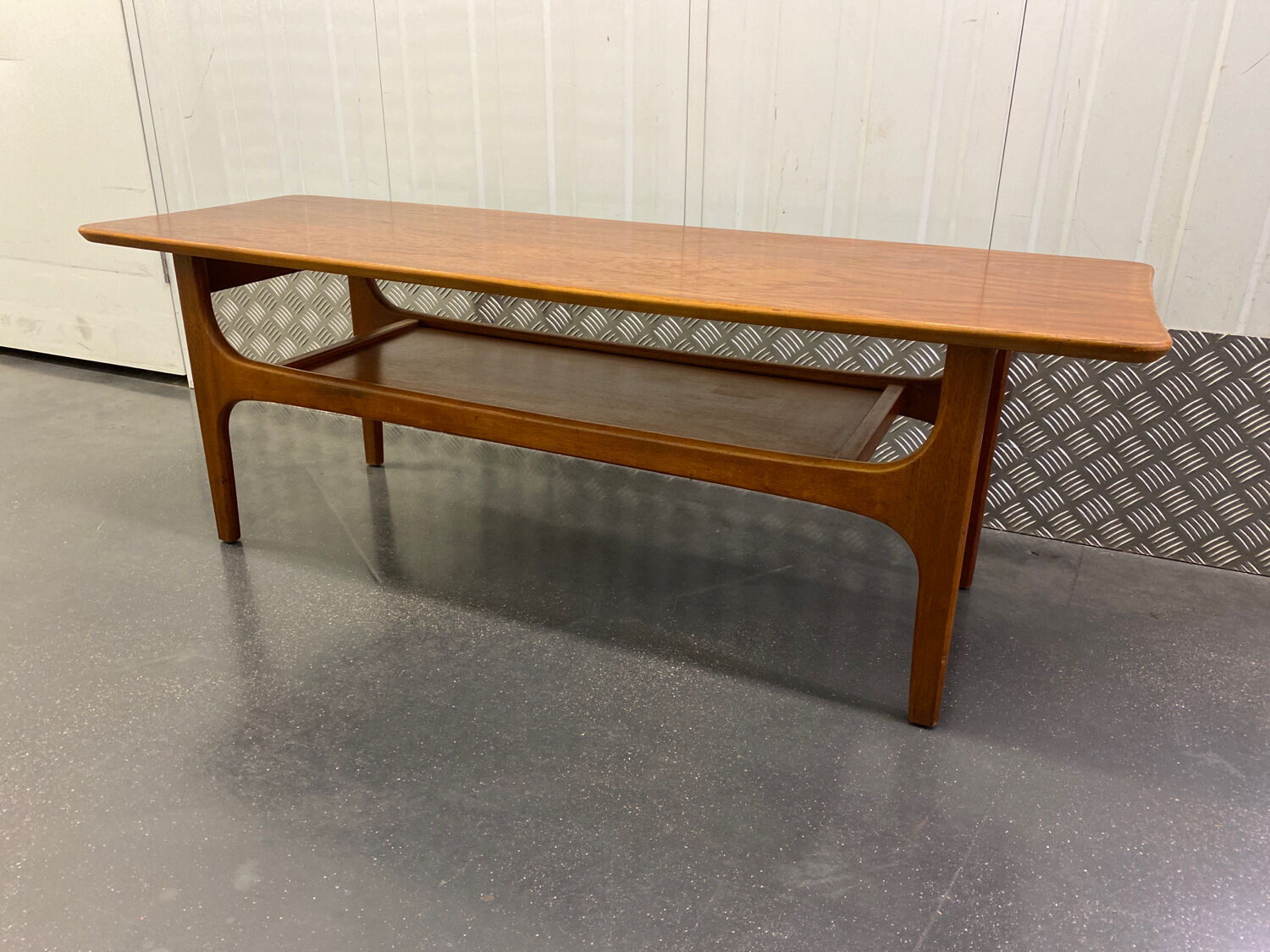 Teak coffee table with under top circa 1960