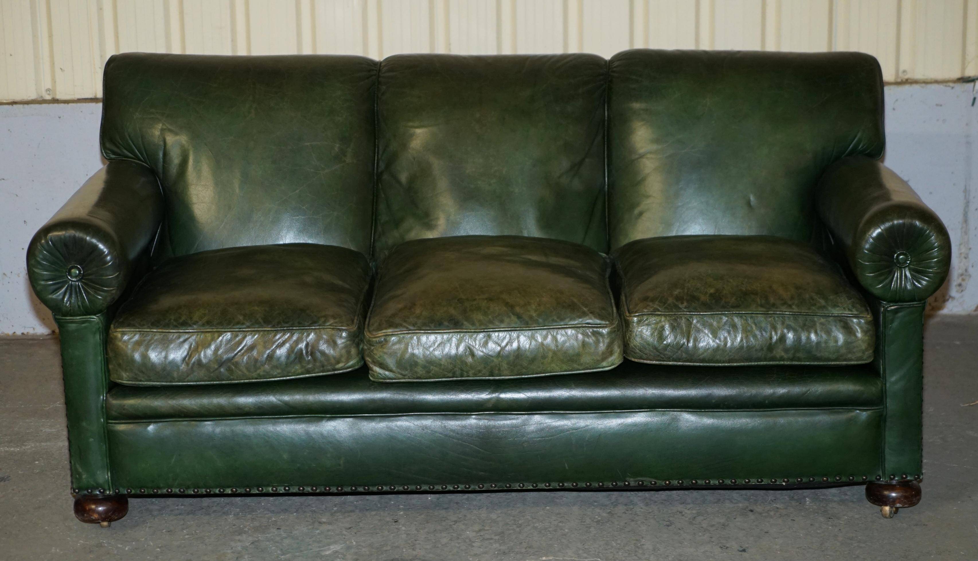 Victorian leather canapé, shield armrests, stamped Maple & Co.