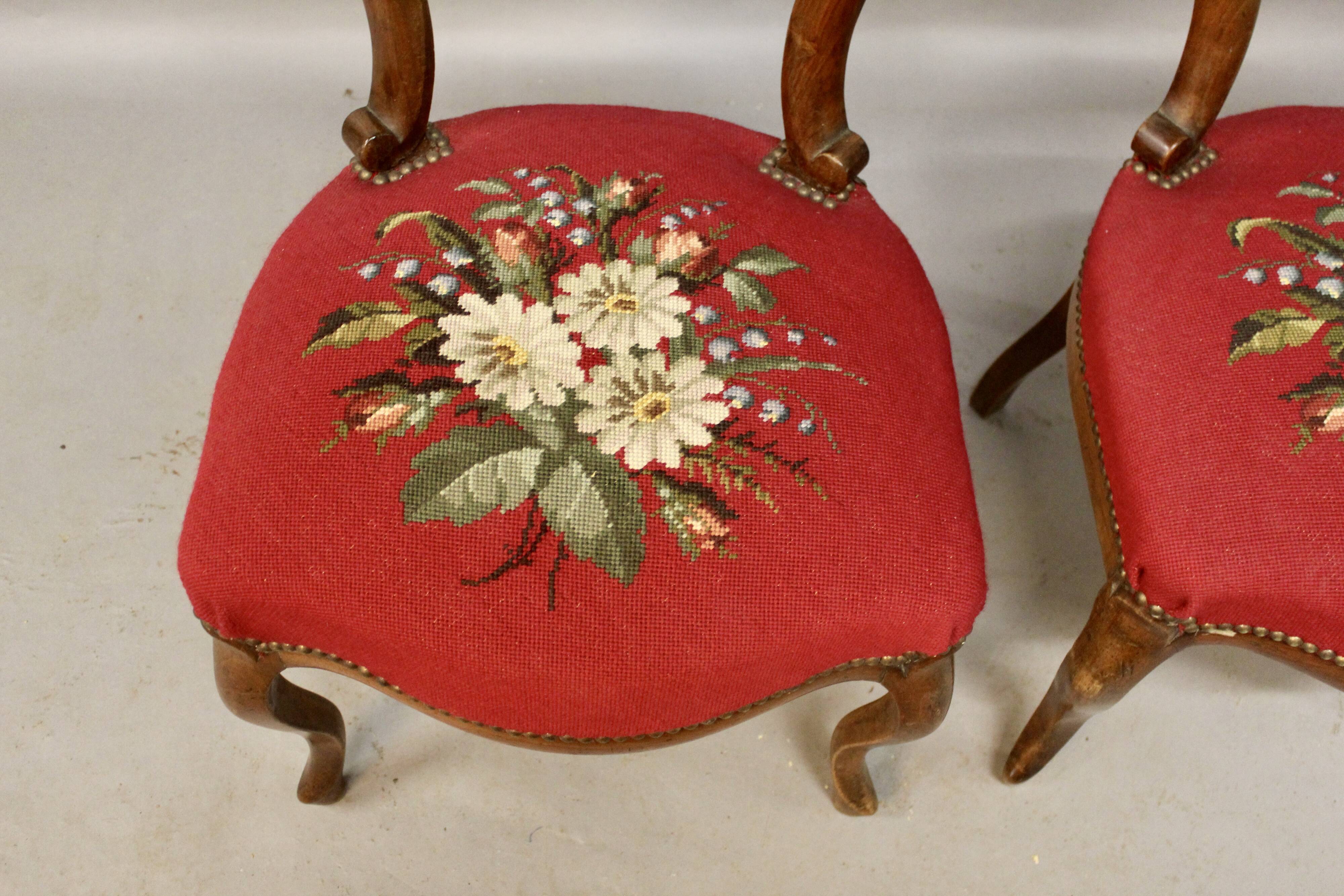 Pair of Louis Philippe walnut chairs, petit point tapestry