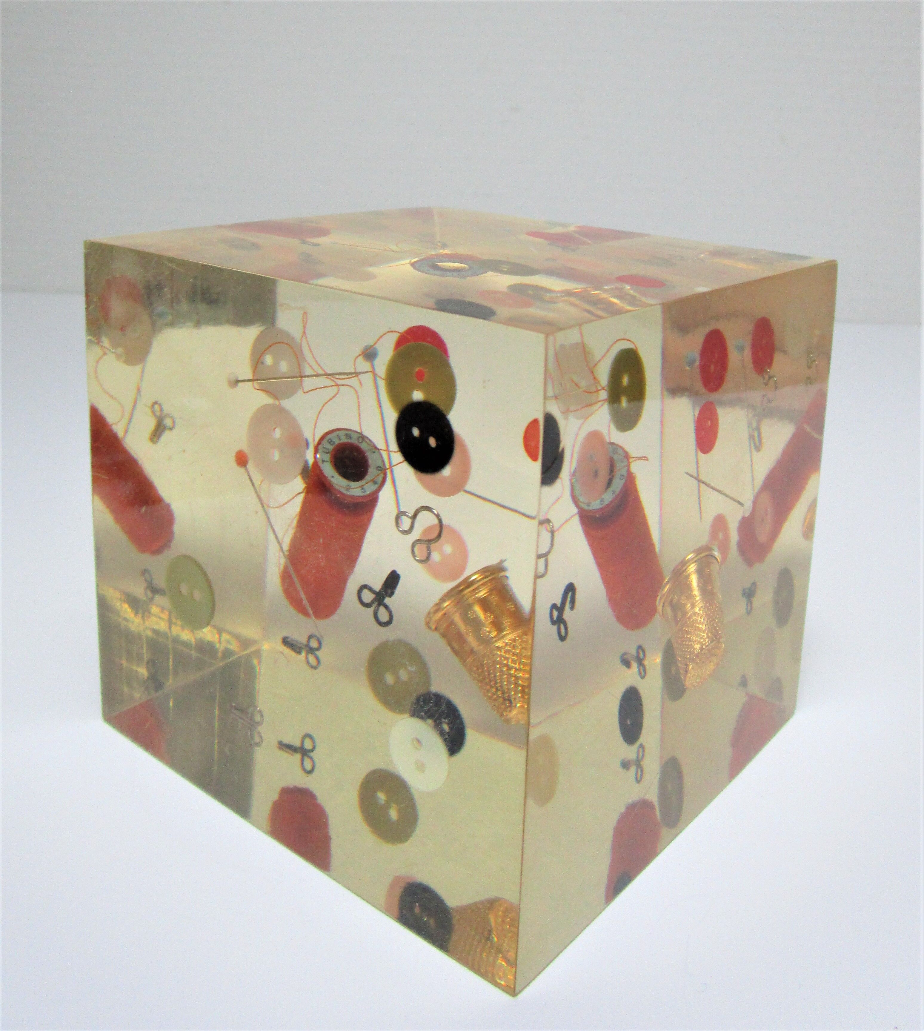 Paperweight sculpture block resin inclusions sewing design 70s