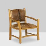 Brutalist style armchair in elm and goatskin, 1970s