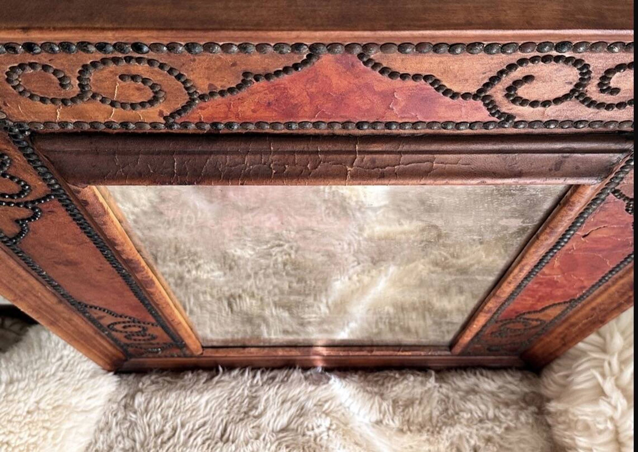 Antique mirror designed by "Pierre Lottier". Leather and nails. France 1