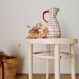Antique stool with wood and cream caning.