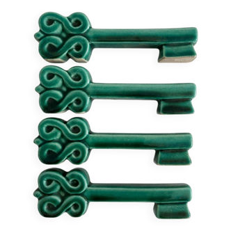 4 green ceramic knife rests in vintage key shape