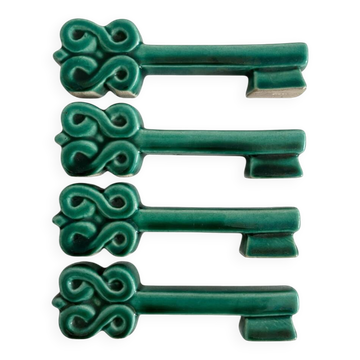 4 porte-couteaux en céramique verte forme clef vintage