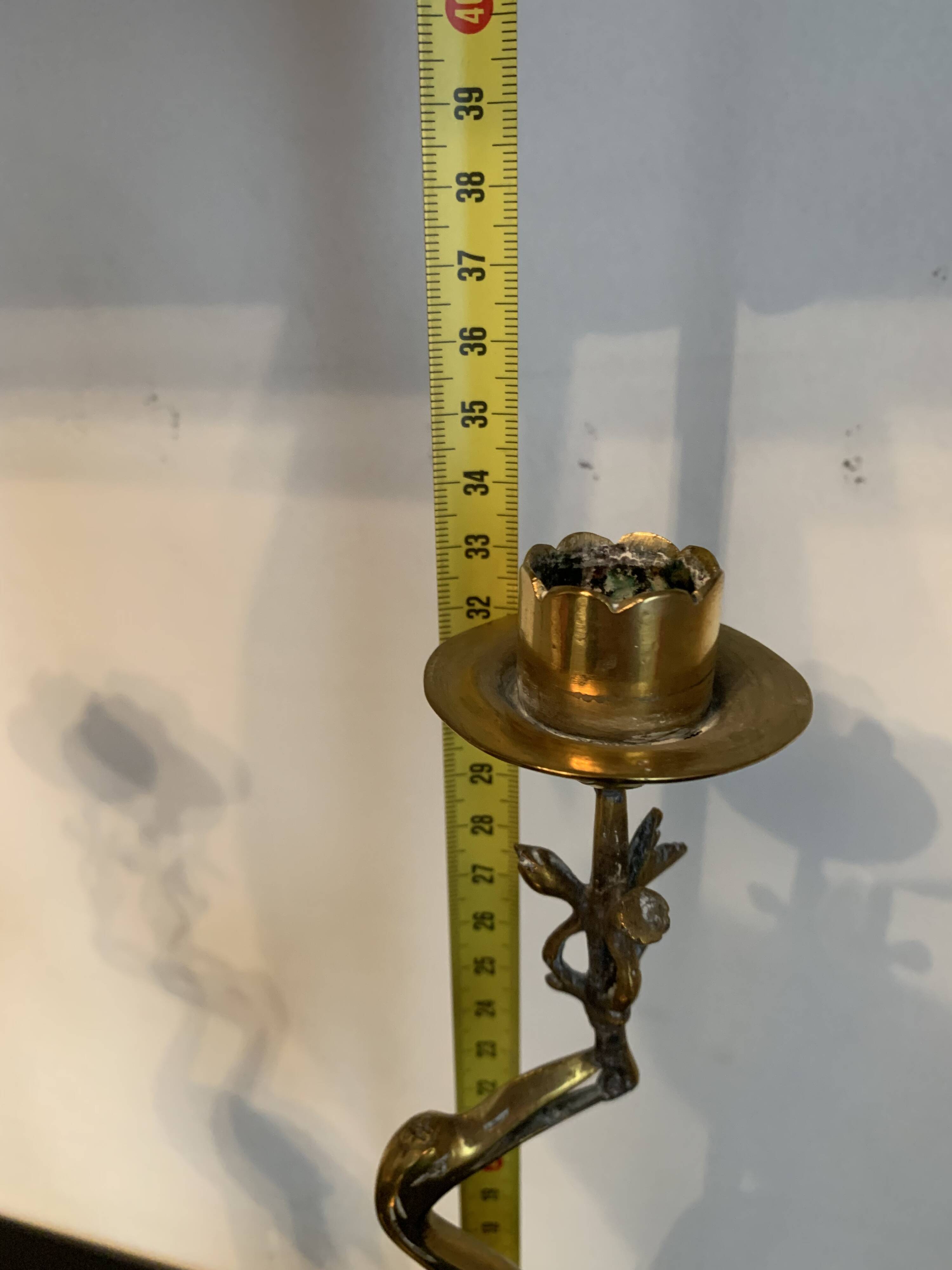 Pair of chiseled and gilded bronze candlesticks depicting perched waders