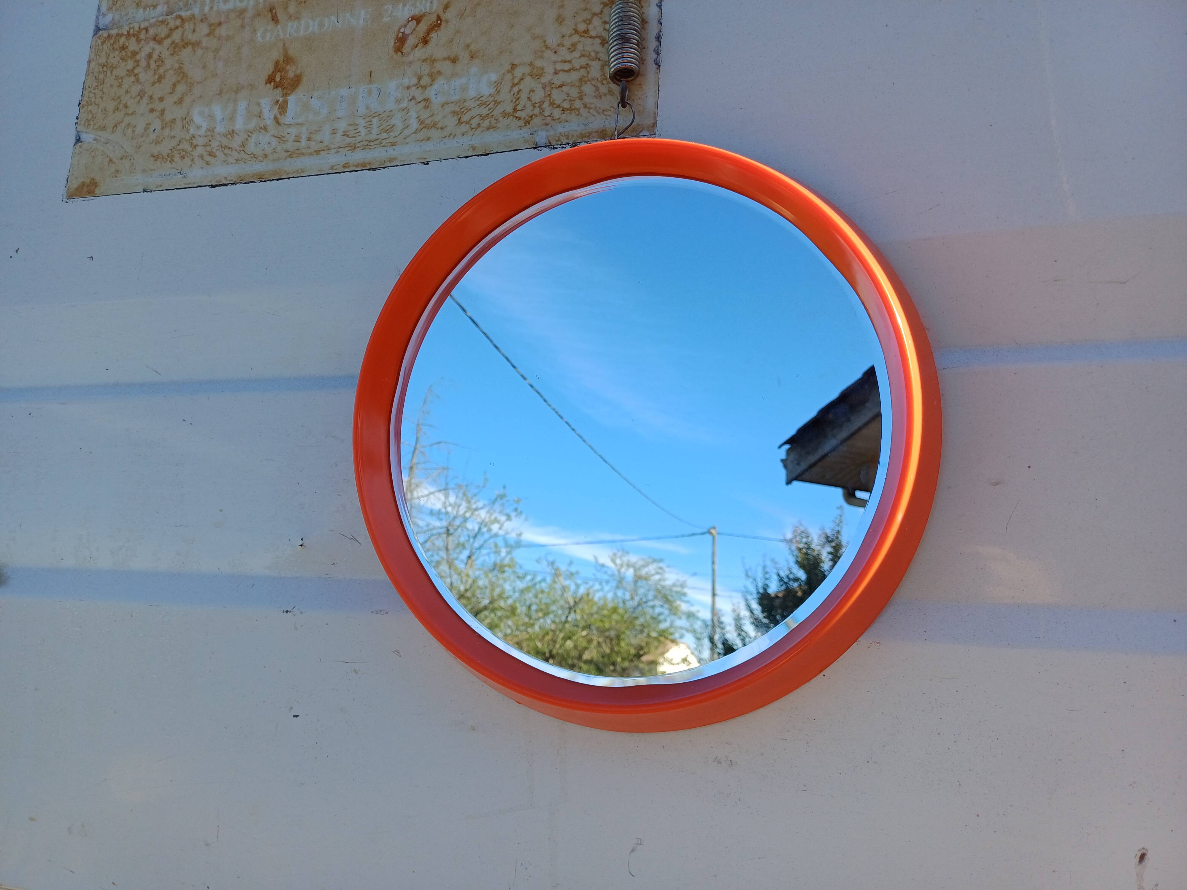 Vintage round plastic orange mirror