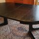 Baumann-type table with 4/8-person extensions.