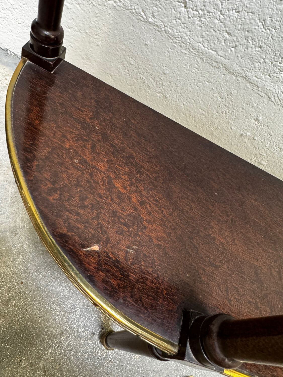 Louis XVI demi-moon console in wood and brass.