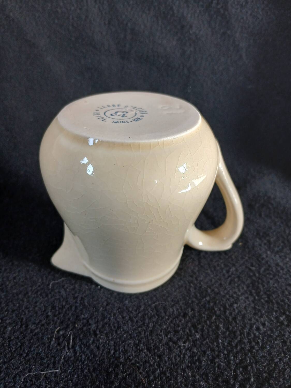 Old milk jug in steel clay