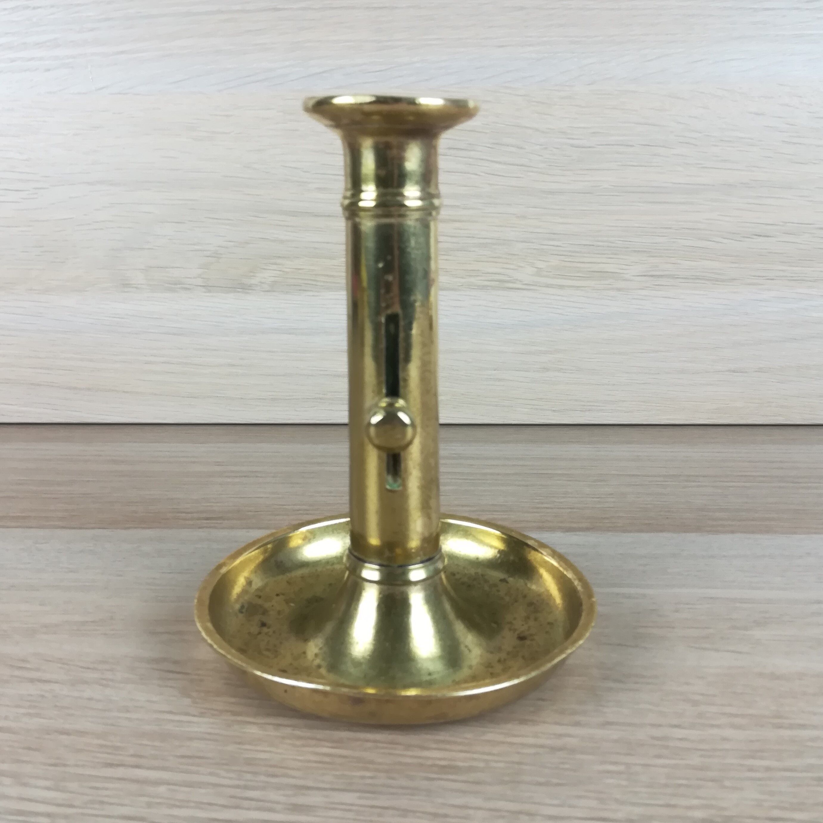 Brass pusher candle holder