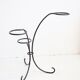 Arched steel flowered foot for balconies and terraces