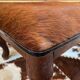 Vintage wooden and goatskin pouf