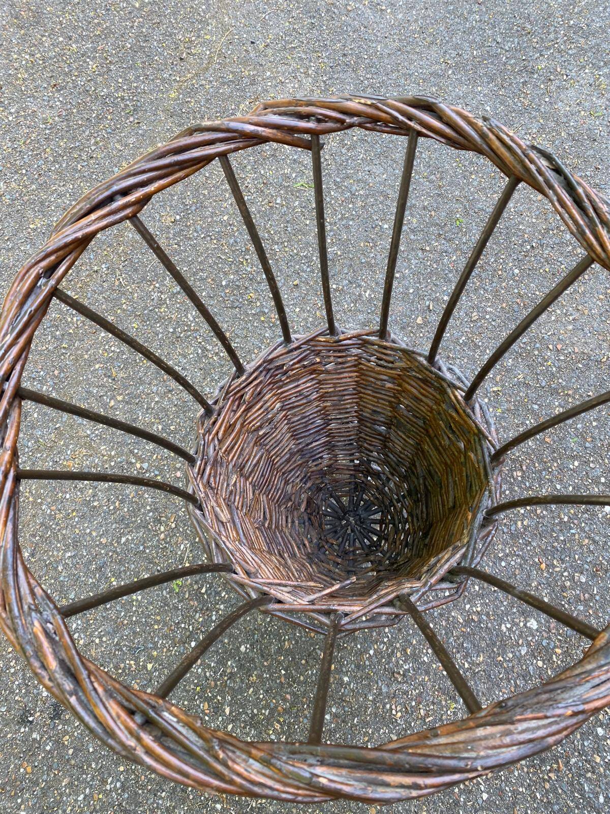 Vintage umbrella stand in rattan, woven wicker, and steel.