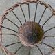 Vintage umbrella stand in rattan, woven wicker, and steel.
