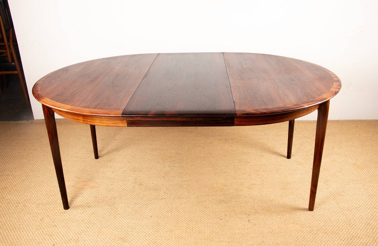Danish extendable dining table in rosewood by Kai Lyngfeldt Larsen.